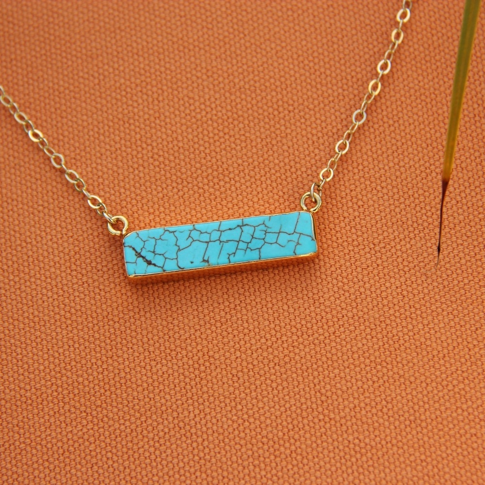 Turquoise color bar pendant necklace. Gold plated